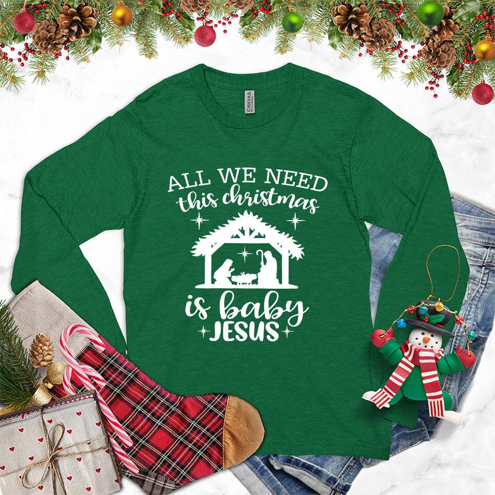 All We Need This Christmas Is Baby Jesus Long Sleeves Kelly - Festive long sleeve tee with Baby Jesus and nativity scene print for Christmas.