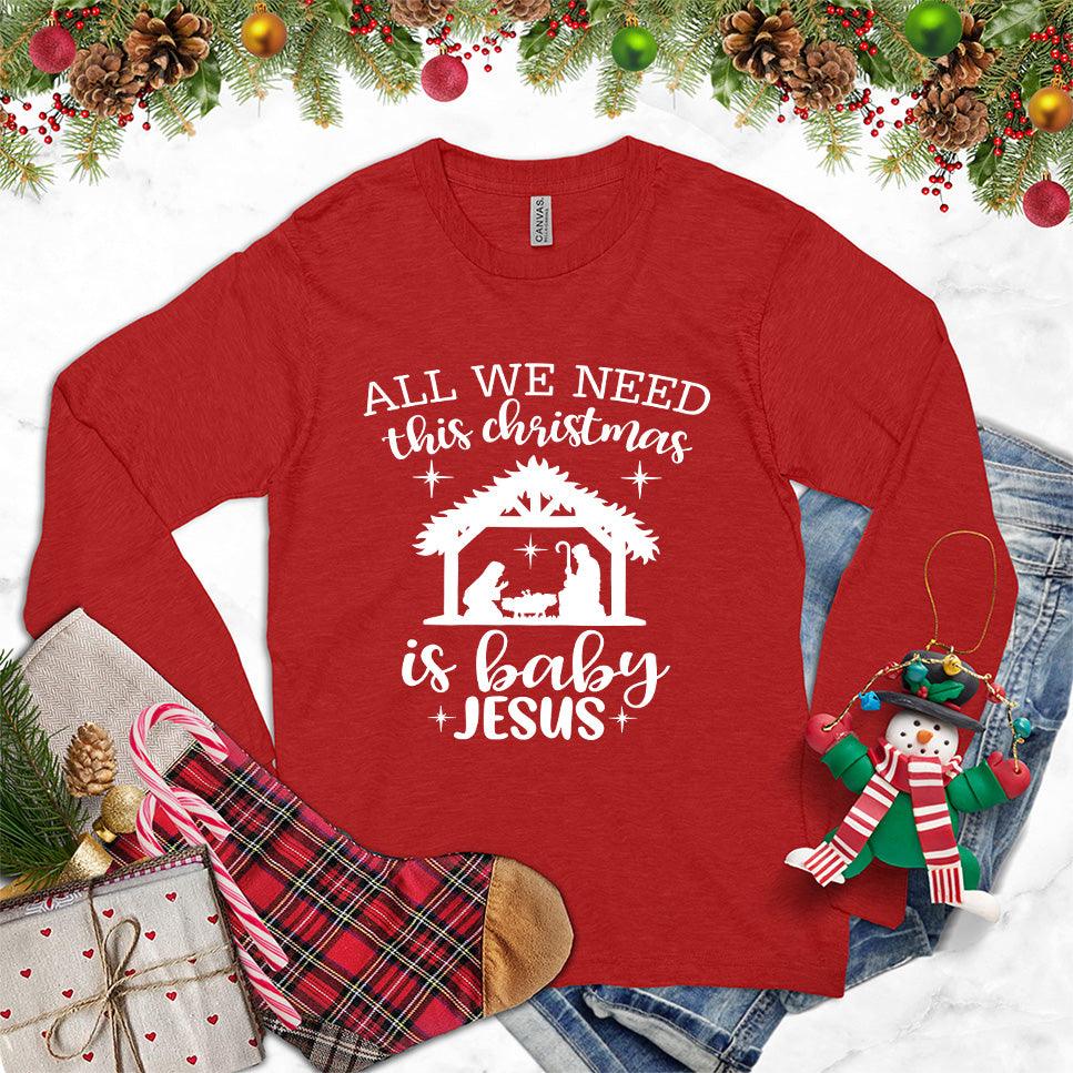 All We Need This Christmas Is Baby Jesus Long Sleeves Red - Festive long sleeve tee with Baby Jesus and nativity scene print for Christmas.