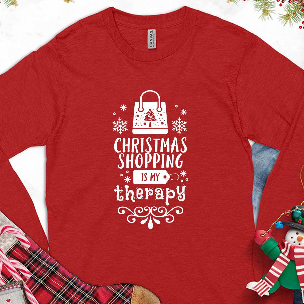 Christmas Shopping Is My Therapy Version 1 Long Sleeves Red - Graphic long sleeve tee with "Christmas Shopping Is My Therapy" slogan surrounded by festive snowflake designs.