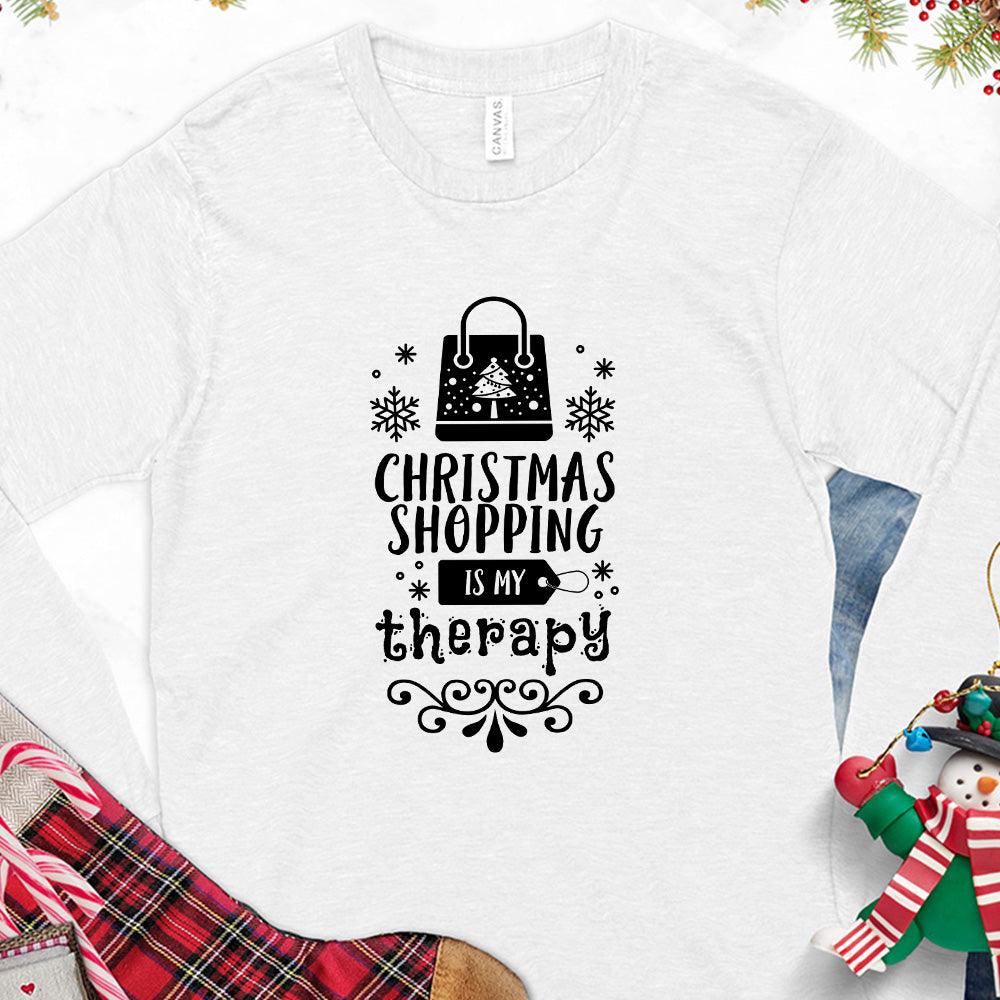 Christmas Shopping Is My Therapy Version 1 Long Sleeves White - Graphic long sleeve tee with "Christmas Shopping Is My Therapy" slogan surrounded by festive snowflake designs.