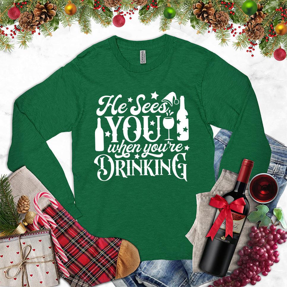 He Sees You When You're Drinking Long Sleeves Kelly - Humorous long sleeve holiday shirt with festive drinking phrase design