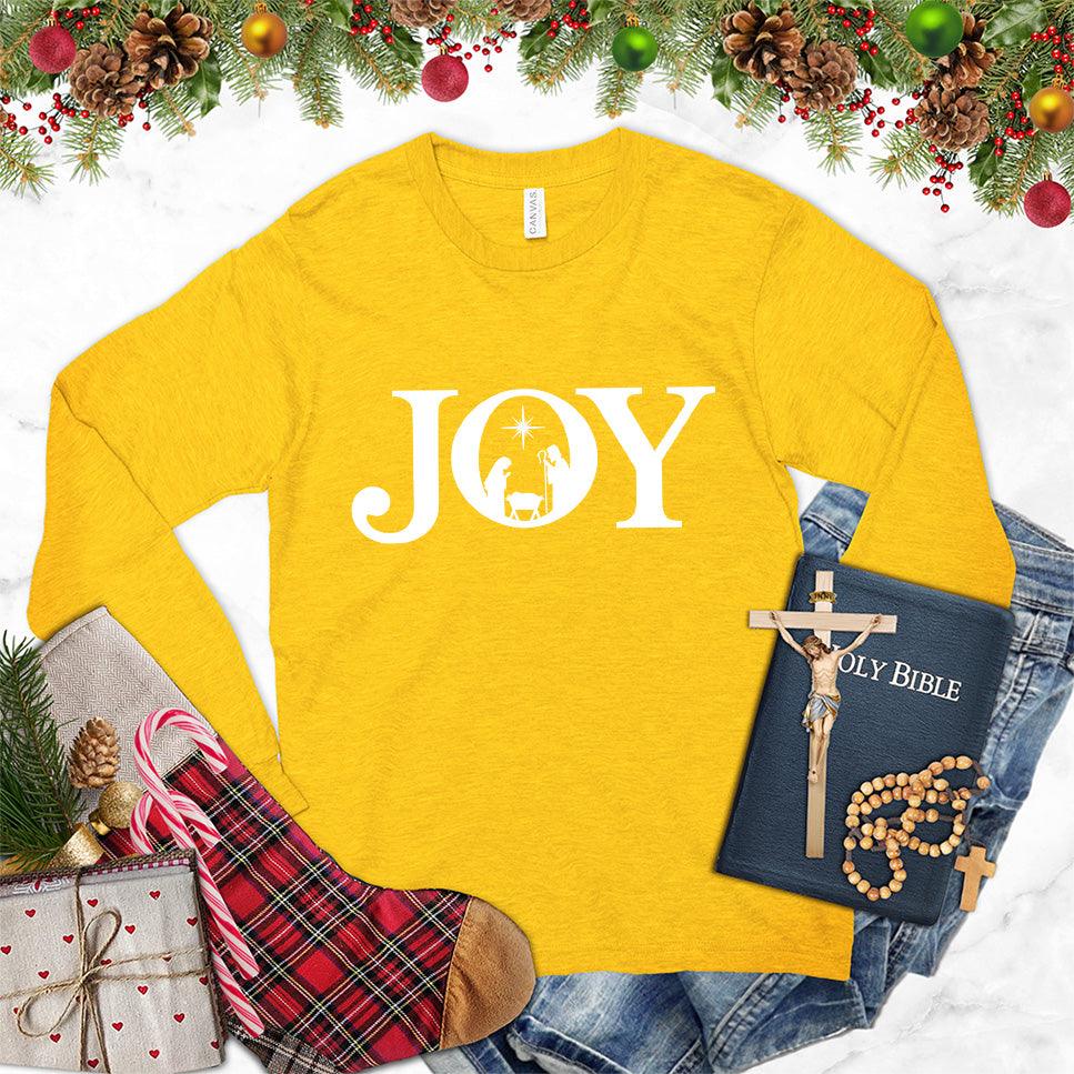 Joy Version 2 Long Sleeves Gold - Trendy long sleeve shirt with "JOY" and nature-inspired graphic print for all-season wear.