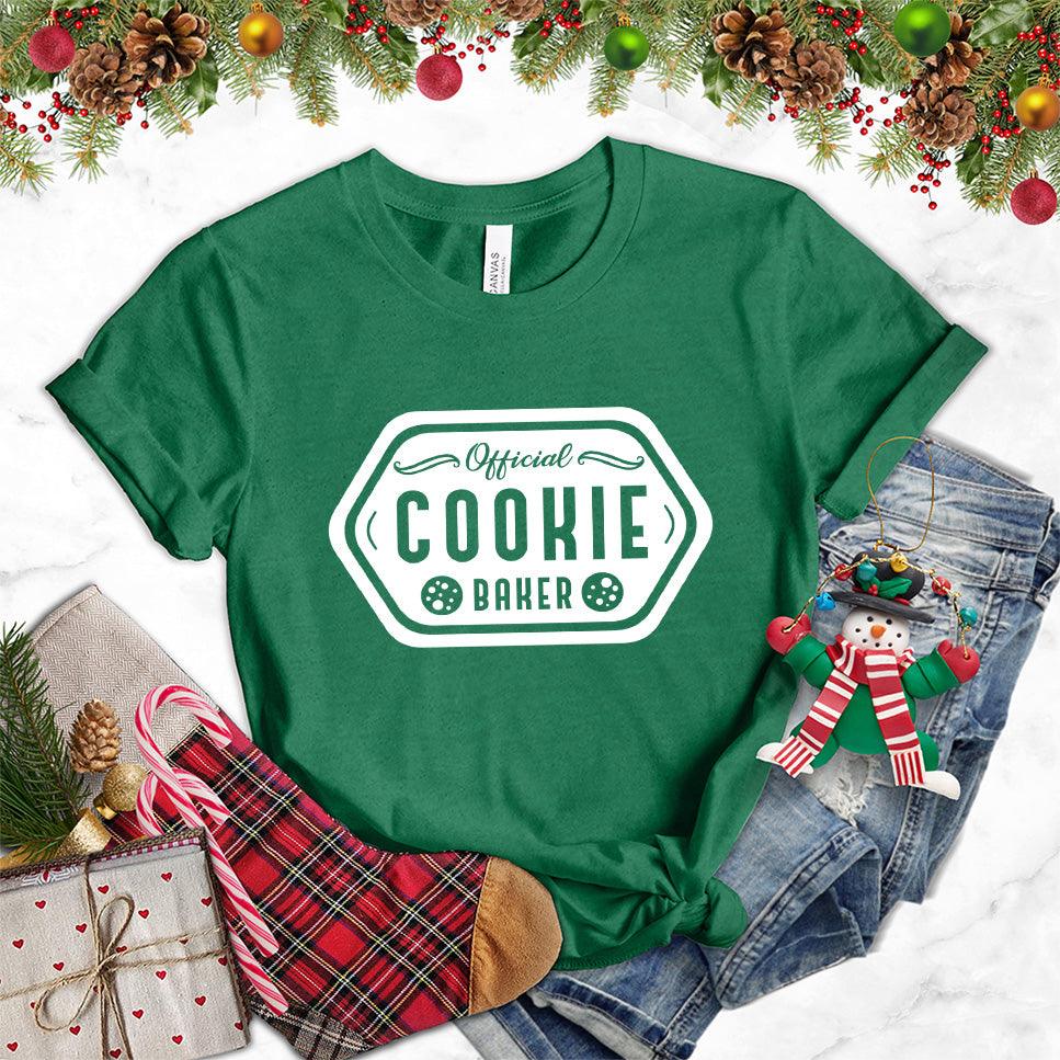 Official Cookie Baker T-Shirt Heather Grass Green - Graphic tee with 'Official Cookie Baker' logo in a festive kitchen setting