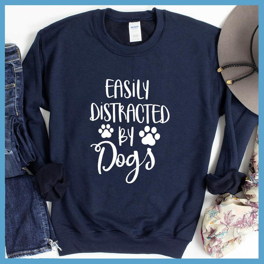 Easily Distracted By Dogs Sweatshirt Navy - Fun and cozy 'Easily Distracted By Dogs' sweatshirt with playful paw prints design.