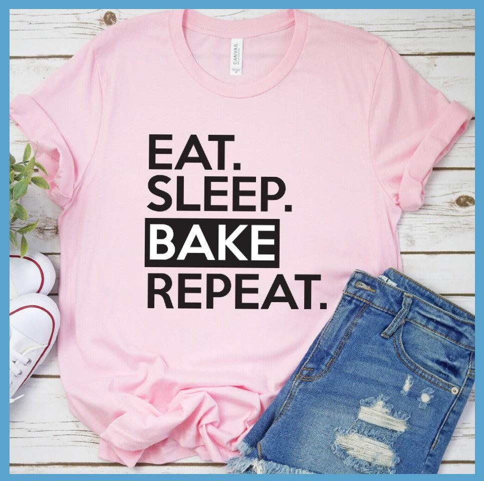 Eat Sleep Bake Repeat T-Shirt Pink - Illustration of fun 'Eat Sleep Bake Repeat' phrase on casual t-shirt for baking fans