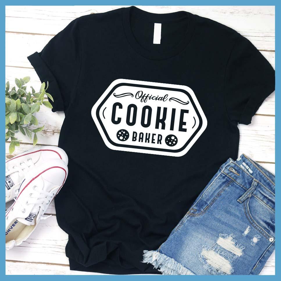 Official Cookie Baker T-Shirt Black - Graphic tee with 'Official Cookie Baker' logo in a festive kitchen setting