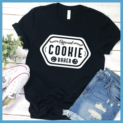 Official Cookie Baker T-Shirt Black - Graphic tee with 'Official Cookie Baker' logo in a festive kitchen setting