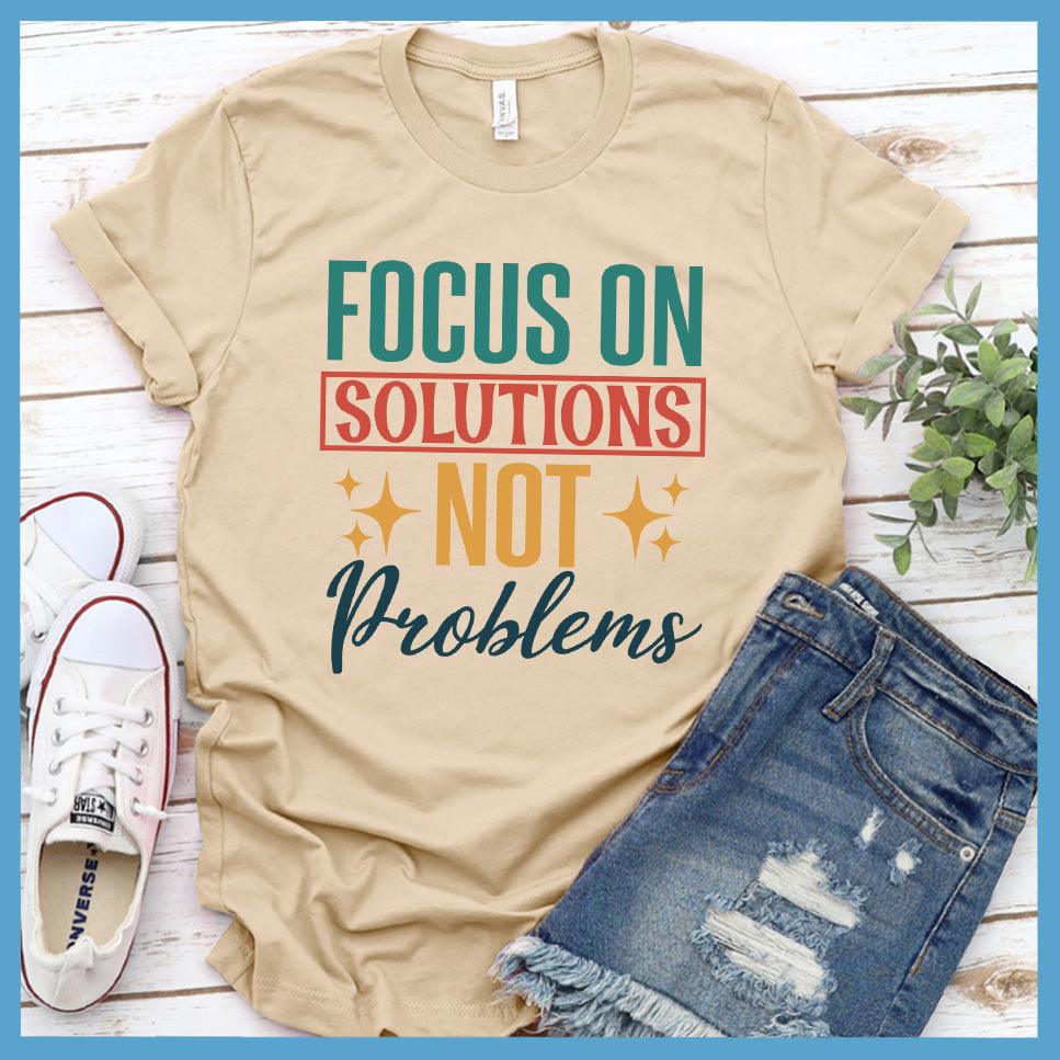 Focus On Solutions Not Problems T-Shirt Colored Edition Soft Cream - Inspirational graphic tee with "Focus On Solutions Not Problems" message for positive vibe styling.