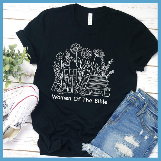 Women Of The Bible T-Shirt Black - Inspirational "Women Of The Bible" graphic tee with floral and book motifs against a casual backdrop.