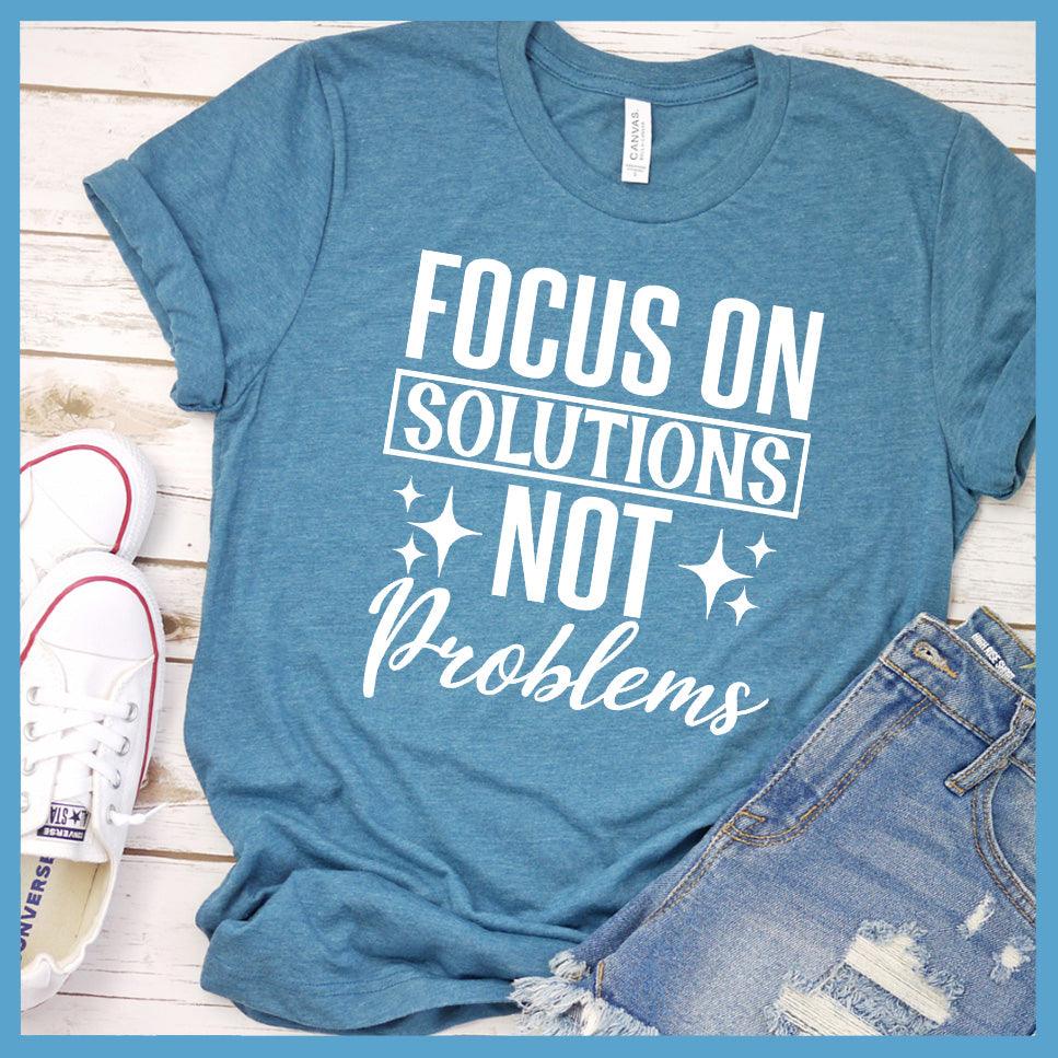 Focus On Solutions Not Problems T-Shirt Colored Edition Heather Deep Teal - Inspirational graphic tee with "Focus On Solutions Not Problems" message for positive vibe styling.