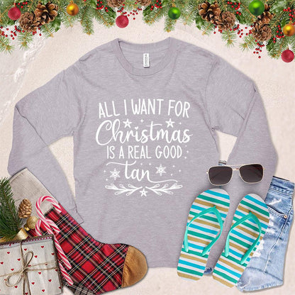 All I Want For Christmas Is A Real Good Tan Long Sleeves Storm - Holiday-themed long sleeve shirt with a whimsical Christmas and beach design, perfect for relaxed festive style.