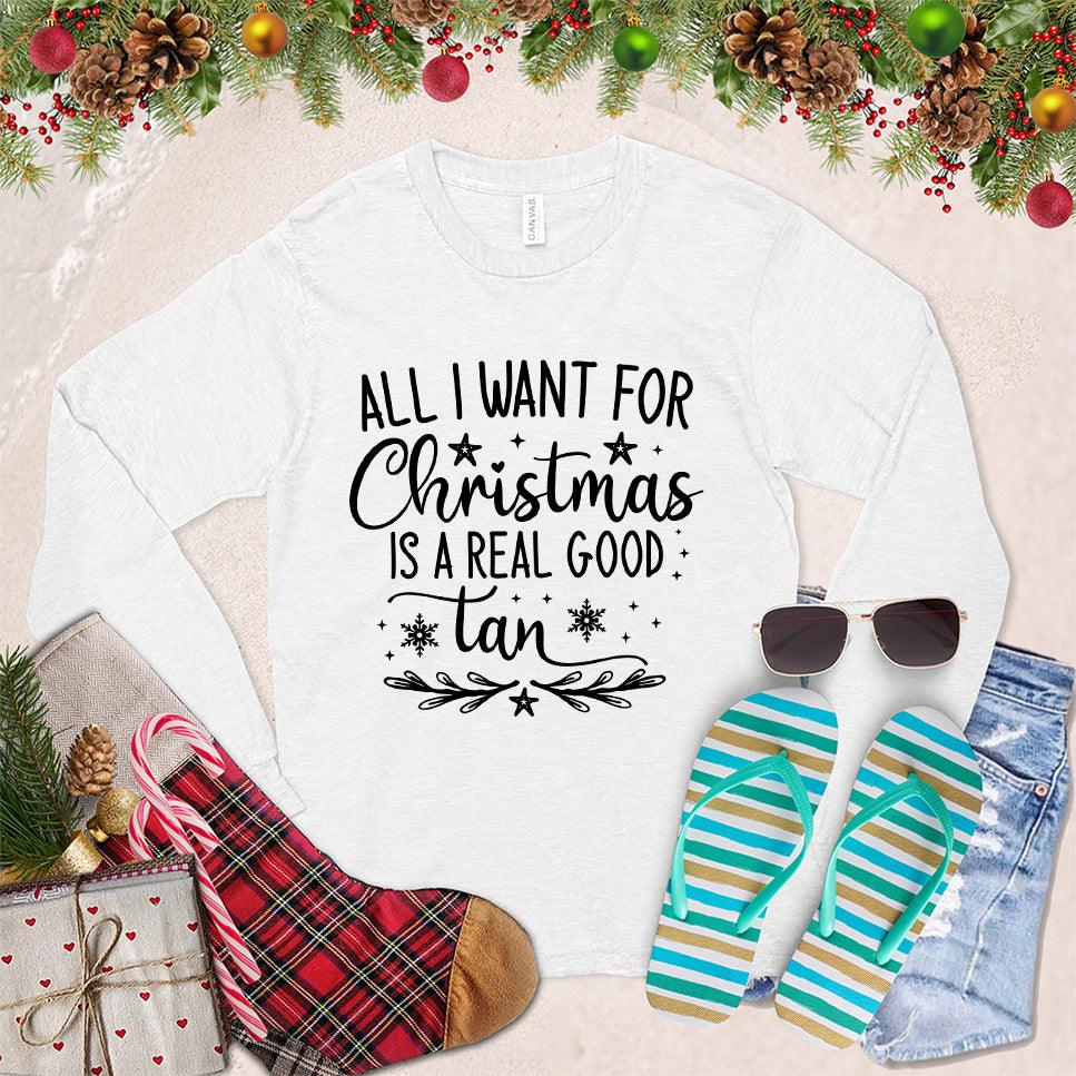 All I Want For Christmas Is A Real Good Tan Long Sleeves White - Holiday-themed long sleeve shirt with a whimsical Christmas and beach design, perfect for relaxed festive style.