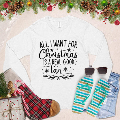 All I Want For Christmas Is A Real Good Tan Long Sleeves White - Holiday-themed long sleeve shirt with a whimsical Christmas and beach design, perfect for relaxed festive style.