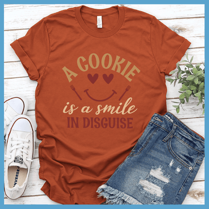 A Cookie Is A Smile In Disguise T-Shirt Colored Edition Autumn - Cheerful t-shirt with quote about cookies and happiness, ideal for bakers and style enthusiasts.