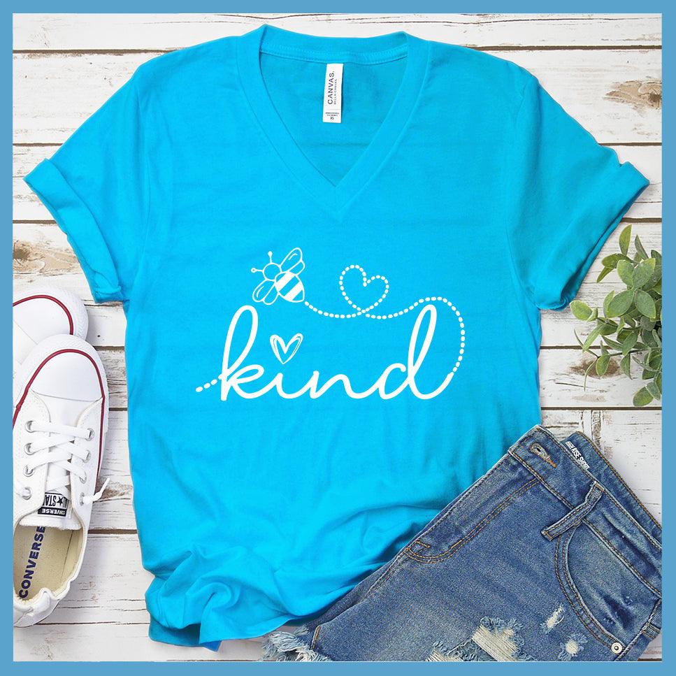 Bee Kind V-Neck Neon Blue - Bee Kind script on V-neck tee with heart and bee details for positive fashion statement.