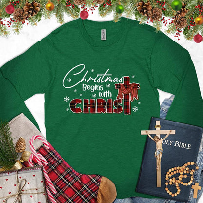 Christmas Begins With Christ Colored Edition Long Sleeves Kelly - Long-sleeved holiday shirt with "Christmas Begins With Christ" design, festive and faith-inspired.