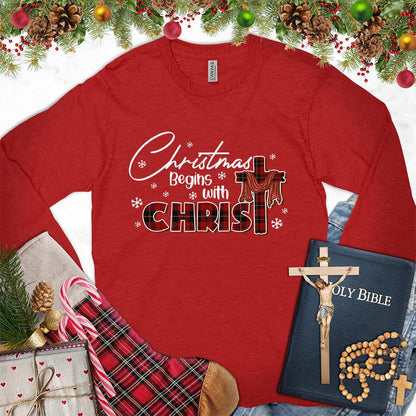 Christmas Begins With Christ Colored Edition Long Sleeves Red - Long-sleeved holiday shirt with "Christmas Begins With Christ" design, festive and faith-inspired.