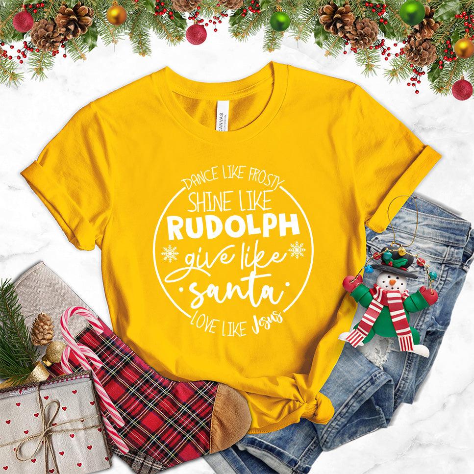 Dance Like Frosty Shine Like Rudolph Give Like Santa Love Like Jesus T-Shirt Gold - Holiday-themed T-shirt with inspirational Christmas phrases and snowflake graphics