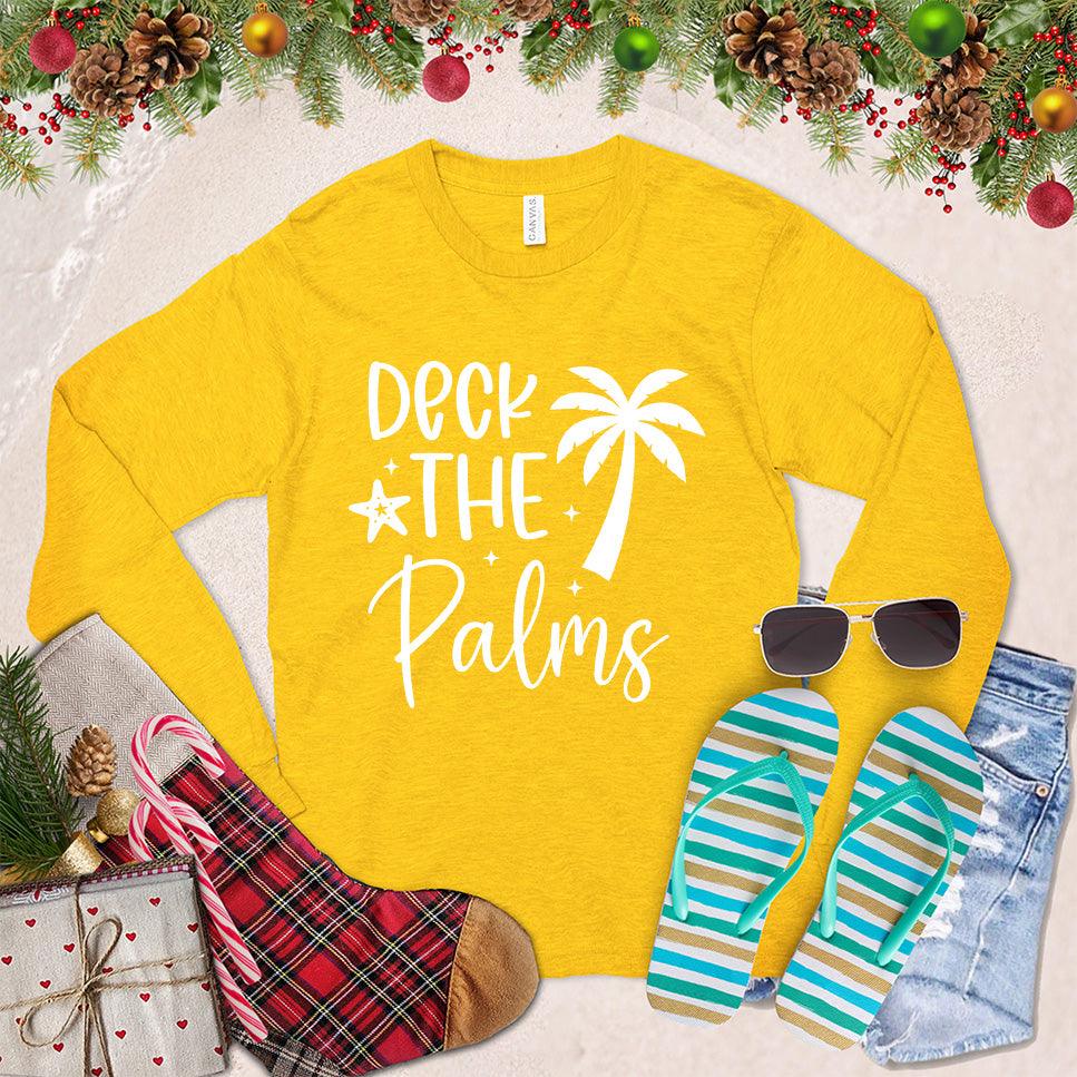 Deck The Palms Long Sleeves Gold - Trendy long sleeve shirt featuring a festive "Deck The Palms" graphic, perfect for seasonal celebrations.