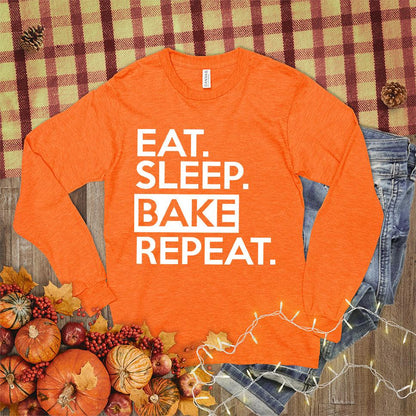 Eat Sleep Bake Repeat Long Sleeves Orange - Fun long-sleeve shirt with "Eat Sleep Bake Repeat" slogan for baking lovers