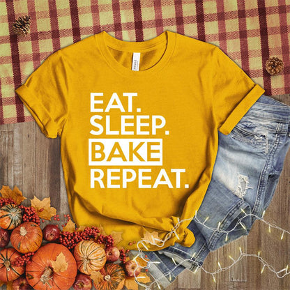 Eat Sleep Bake Repeat T-Shirt Heather Mustard - Illustration of fun 'Eat Sleep Bake Repeat' phrase on casual t-shirt for baking fans