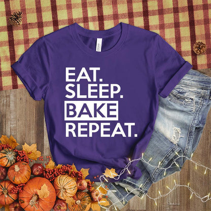 Eat Sleep Bake Repeat T-Shirt Team Purple - Illustration of fun 'Eat Sleep Bake Repeat' phrase on casual t-shirt for baking fans