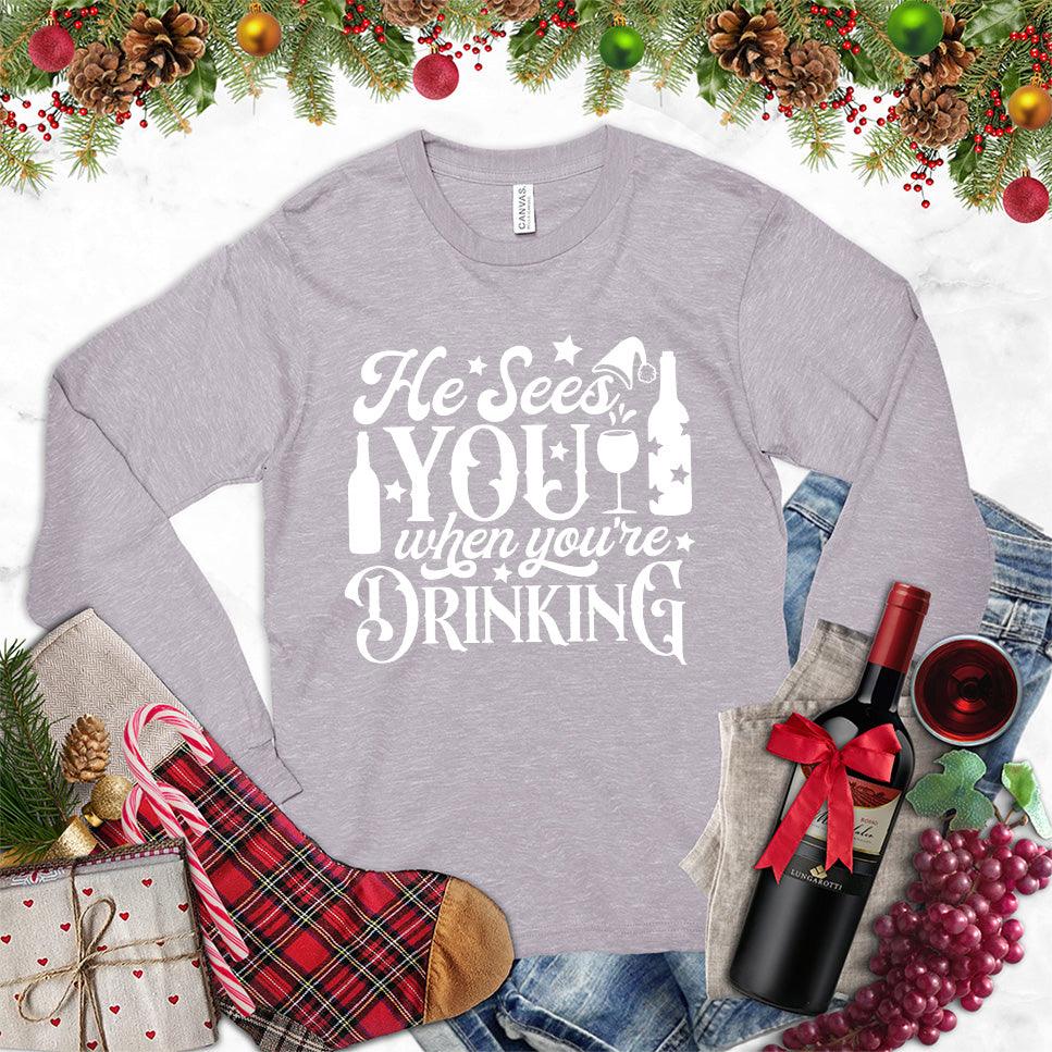 He Sees You When You're Drinking Long Sleeves Storm - Humorous long sleeve holiday shirt with festive drinking phrase design