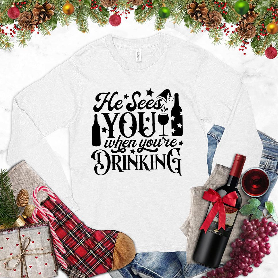 He Sees You When You're Drinking Long Sleeves White - Humorous long sleeve holiday shirt with festive drinking phrase design