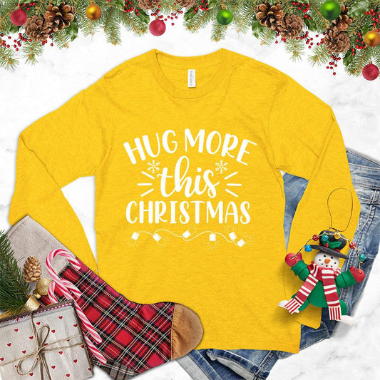 Hug More This Christmas Long Sleeves Gold - Festive long-sleeve tee with 'Hug More This Christmas' design, perfect for holiday warmth and style