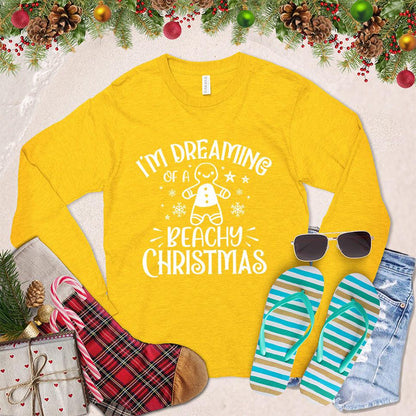 I'm Dreaming Of A Beachy Christmas Long Sleeves Gold - Festive long-sleeved shirt with "Beachy Christmas" graphic, holiday and coastal design elements