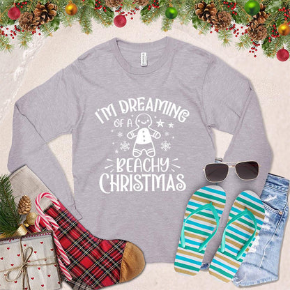I'm Dreaming Of A Beachy Christmas Long Sleeves Storm - Festive long-sleeved shirt with "Beachy Christmas" graphic, holiday and coastal design elements