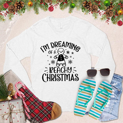 I'm Dreaming Of A Beachy Christmas Long Sleeves White - Festive long-sleeved shirt with "Beachy Christmas" graphic, holiday and coastal design elements