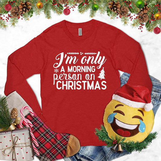 I'm Only A Morning Person On Christmas Long Sleeves Red - Humorous festive long sleeve shirt with Christmas morning slogan and holiday graphics.