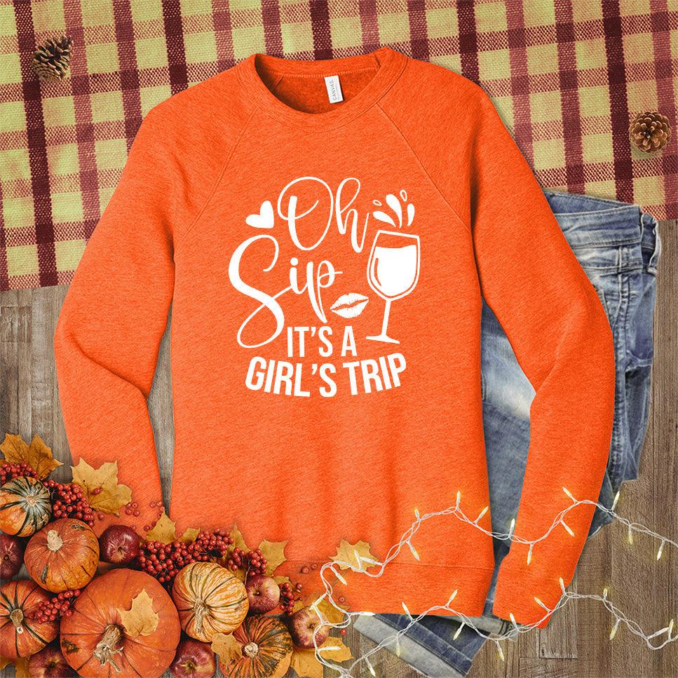 Oh Sip It's A Girl's Trip Sweatshirt Orange - Graphic sweatshirt featuring fun text "Oh Sip It's A Girl's Trip" and wine glass design.