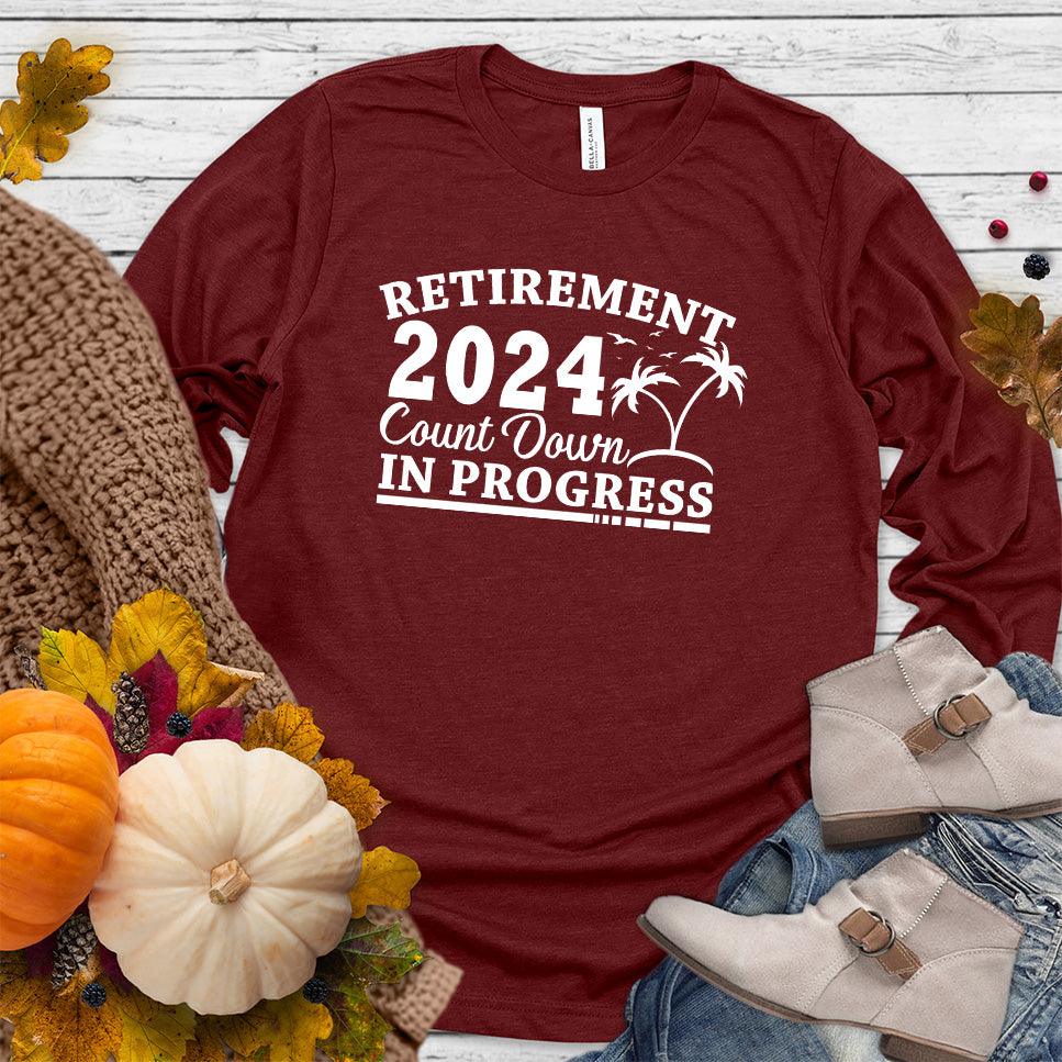 Retirement 2024 Countdown In Progress Long Sleeves Cardinal - "Retirement 2024 Countdown" graphic long sleeve t-shirt with fun beach design.