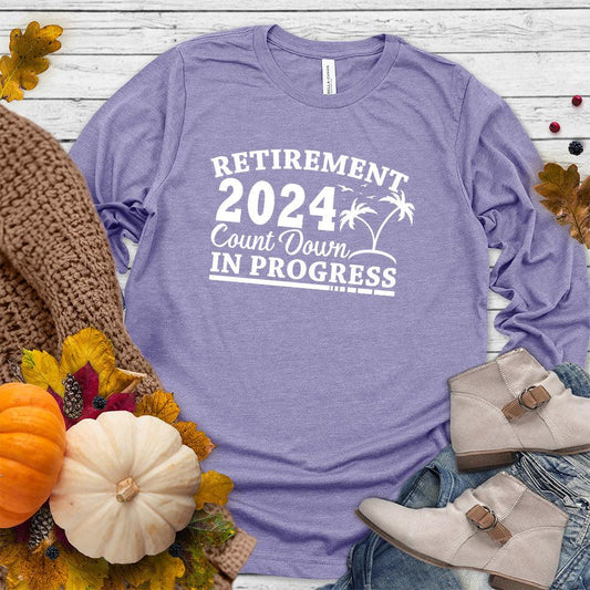 Retirement 2024 Countdown In Progress Long Sleeves Dark Lavender - "Retirement 2024 Countdown" graphic long sleeve t-shirt with fun beach design.