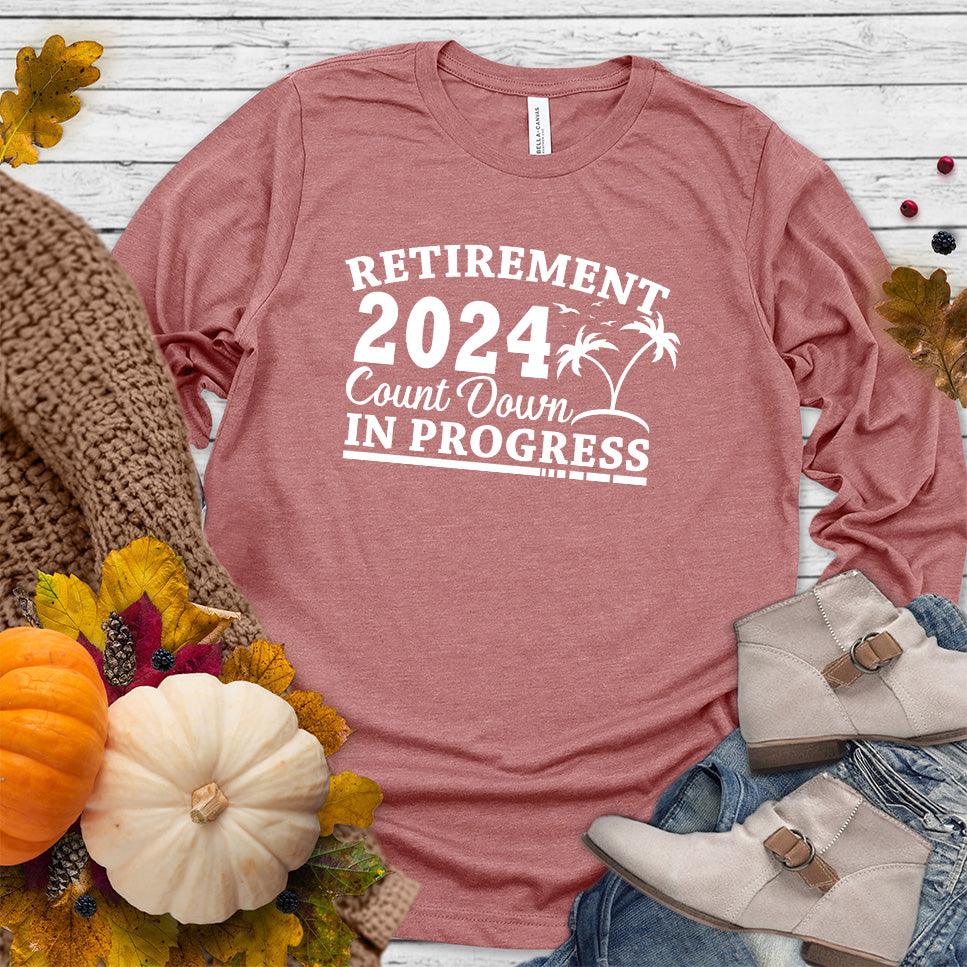 Retirement 2024 Countdown In Progress Long Sleeves Mauve - "Retirement 2024 Countdown" graphic long sleeve t-shirt with fun beach design.