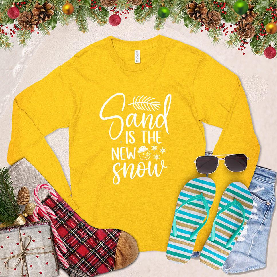 Sand Is The New Snow Long Sleeves Gold - Long sleeve tee with beachy winter design, featuring snowflakes and sand dollar motifs.