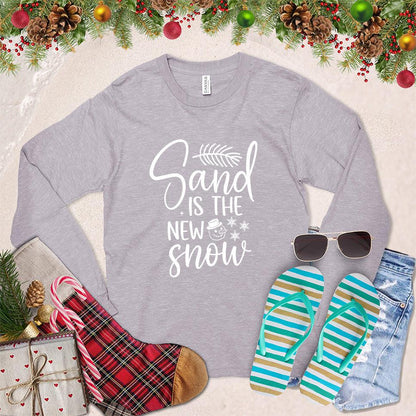 Sand Is The New Snow Long Sleeves Storm - Long sleeve tee with beachy winter design, featuring snowflakes and sand dollar motifs.