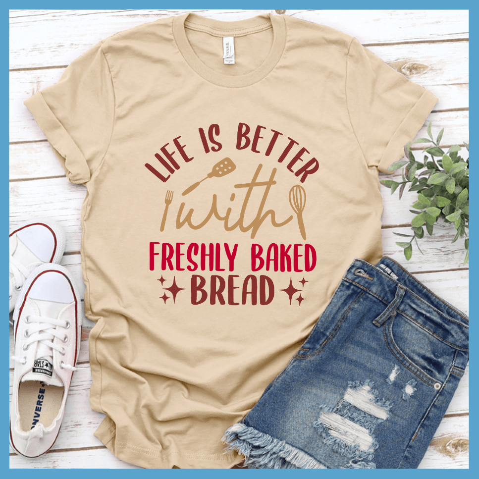 Life Is Better With Freshly Baked Bread T-Shirt Colored Edition Soft Cream - Graphic tee with 'Life Is Better With Freshly Baked Bread' design featuring whisk and rolling pin