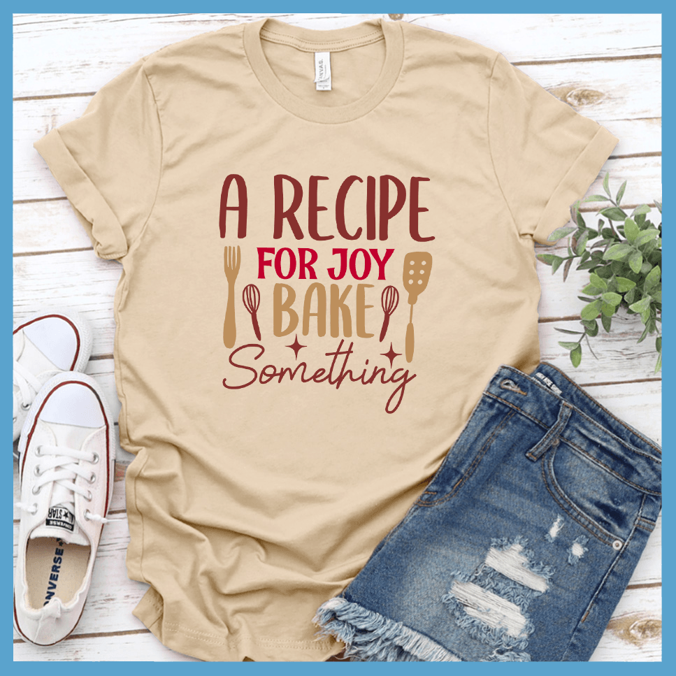 A Recipe For Joy Bake Something T-Shirt Colored Edition Soft Cream - Fun culinary-themed graphic tee with joyful baking design, perfect for casual wear or kitchen adventures.