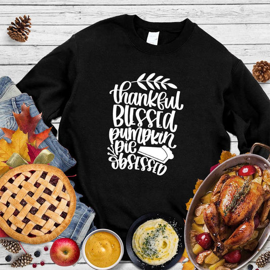 Thankful Blessed Pumpkin Pie Obsessed Sweatshirt Black - Festive sweatshirt with Thankful Blessed Pumpkin Pie lettering, perfect for fall lovers