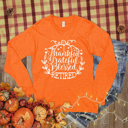 Thankful Grateful Blessed Retired Long Sleeves Orange - "Thankful Grateful Blessed Retired" script on cozy long sleeve shirt for retirees.