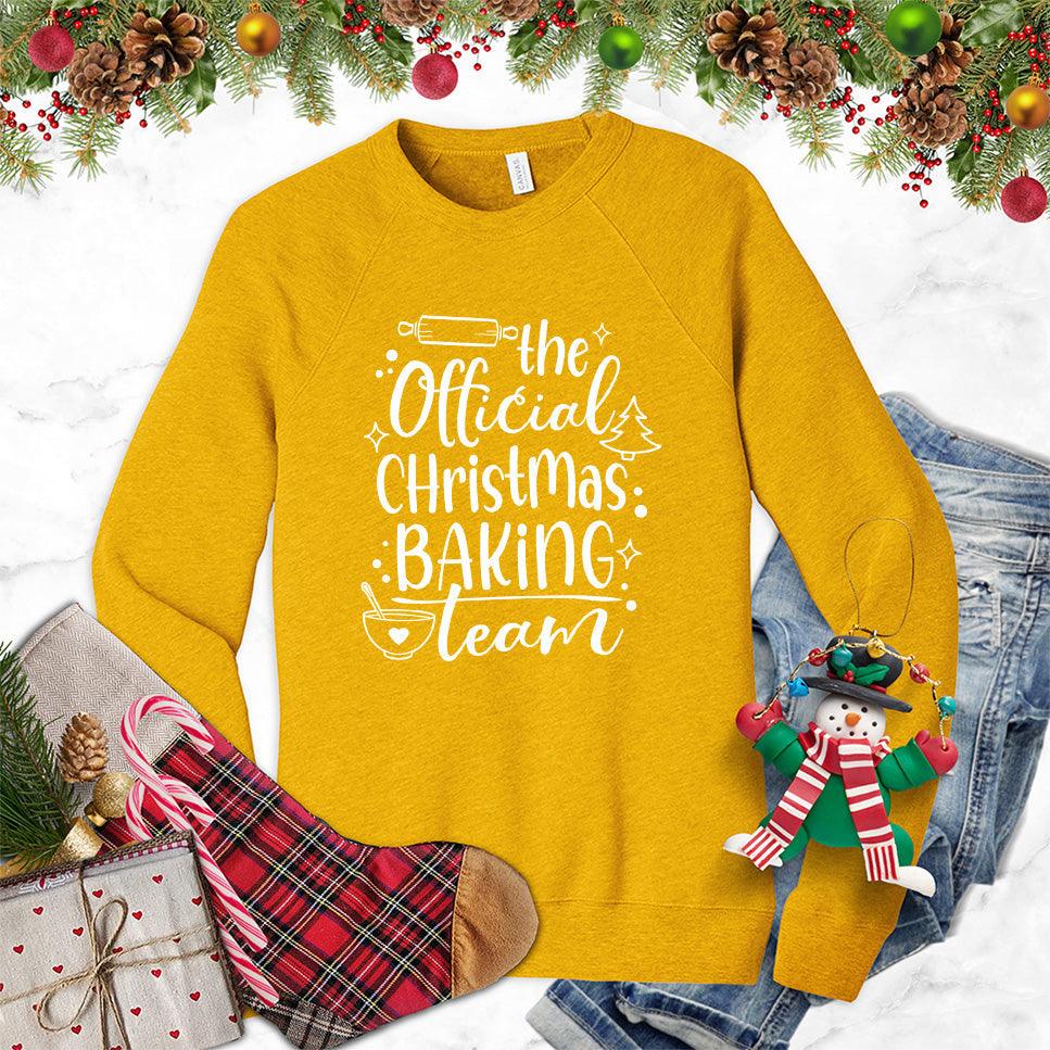 The Official Christmas Baking Team Sweatshirt Heather Mustard - Cozy holiday sweatshirt with Christmas Baking Team design, perfect for festive cooking activities.