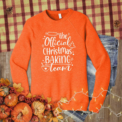 The Official Christmas Baking Team Sweatshirt Orange - Cozy holiday sweatshirt with Christmas Baking Team design, perfect for festive cooking activities.