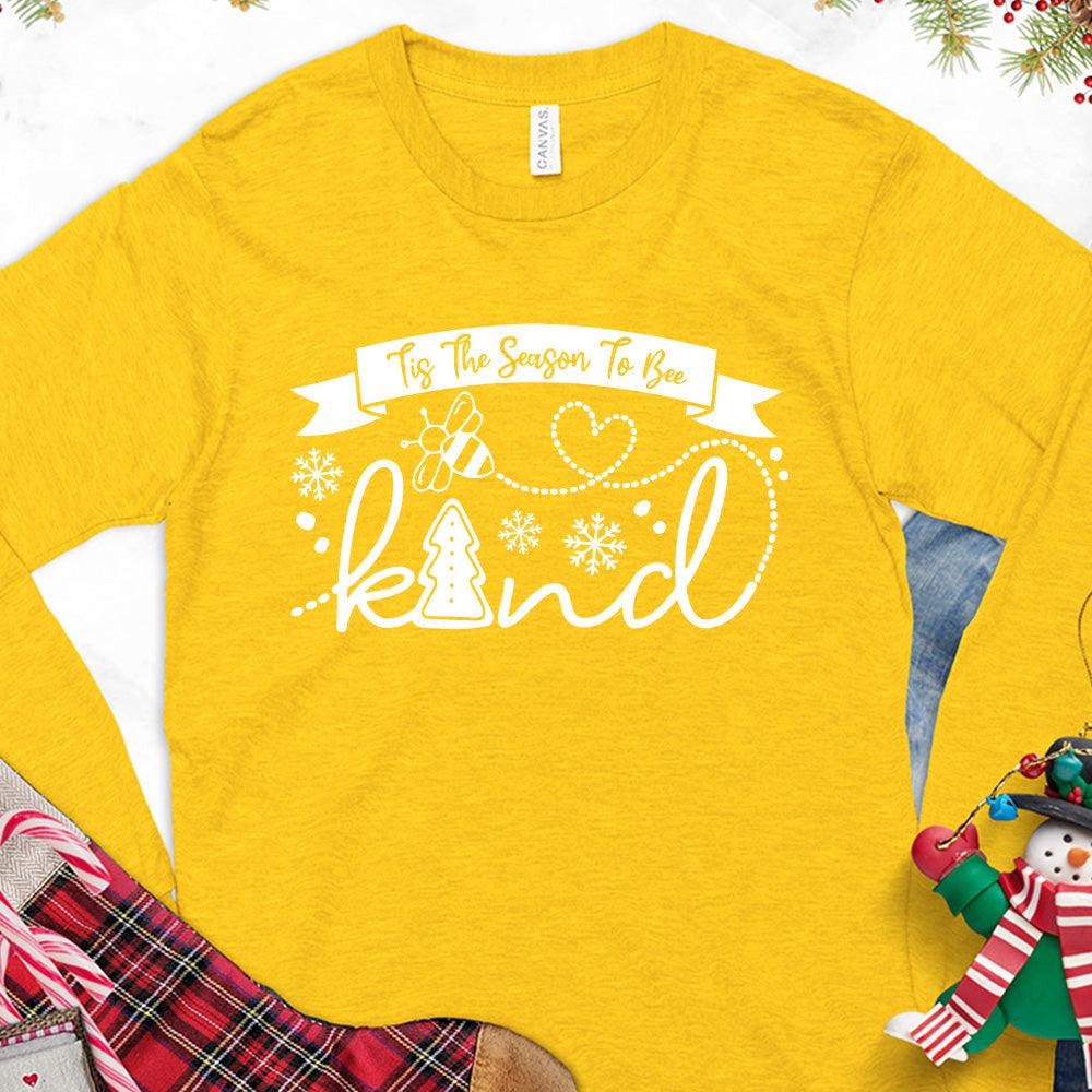 Tis The Season To Bee Kind Version 1 Long Sleeves Gold - Holiday-inspired long sleeve tee with Bee Kind phrase and festive graphics