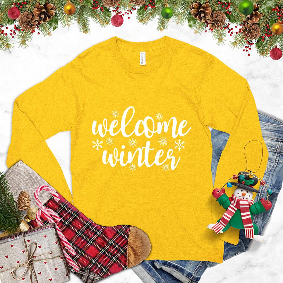 Welcome Winter Long Sleeves Gold - Stylish unisex long sleeve shirt with "Welcome Winter" script and snowflake designs, ideal for seasonal fashion.