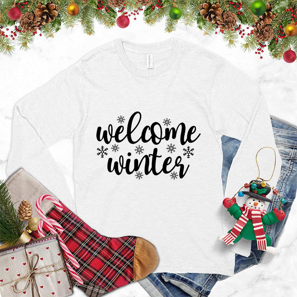 Welcome Winter Long Sleeves White - Stylish unisex long sleeve shirt with "Welcome Winter" script and snowflake designs, ideal for seasonal fashion.