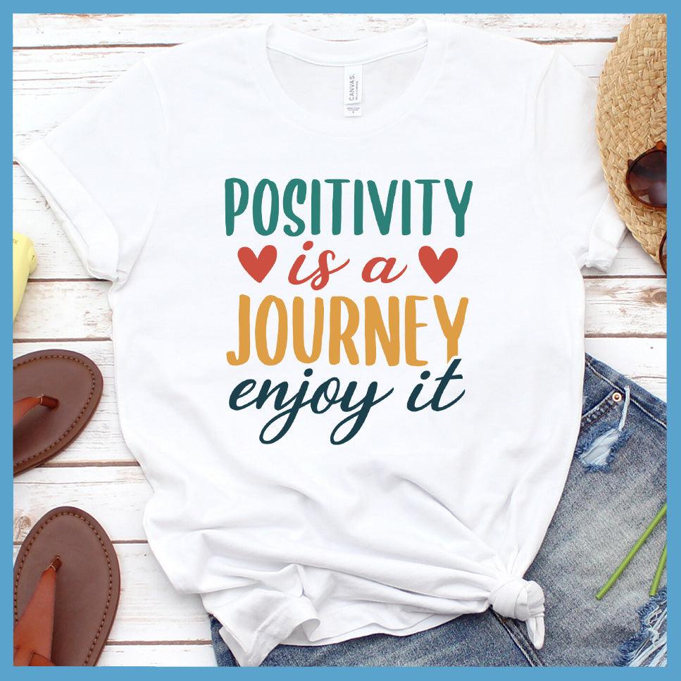 Positivity Is A Journey Enjoy It T-Shirt Colored Edition White - Inspirational quote t-shirt with 'Positivity is a Journey Enjoy It' message.