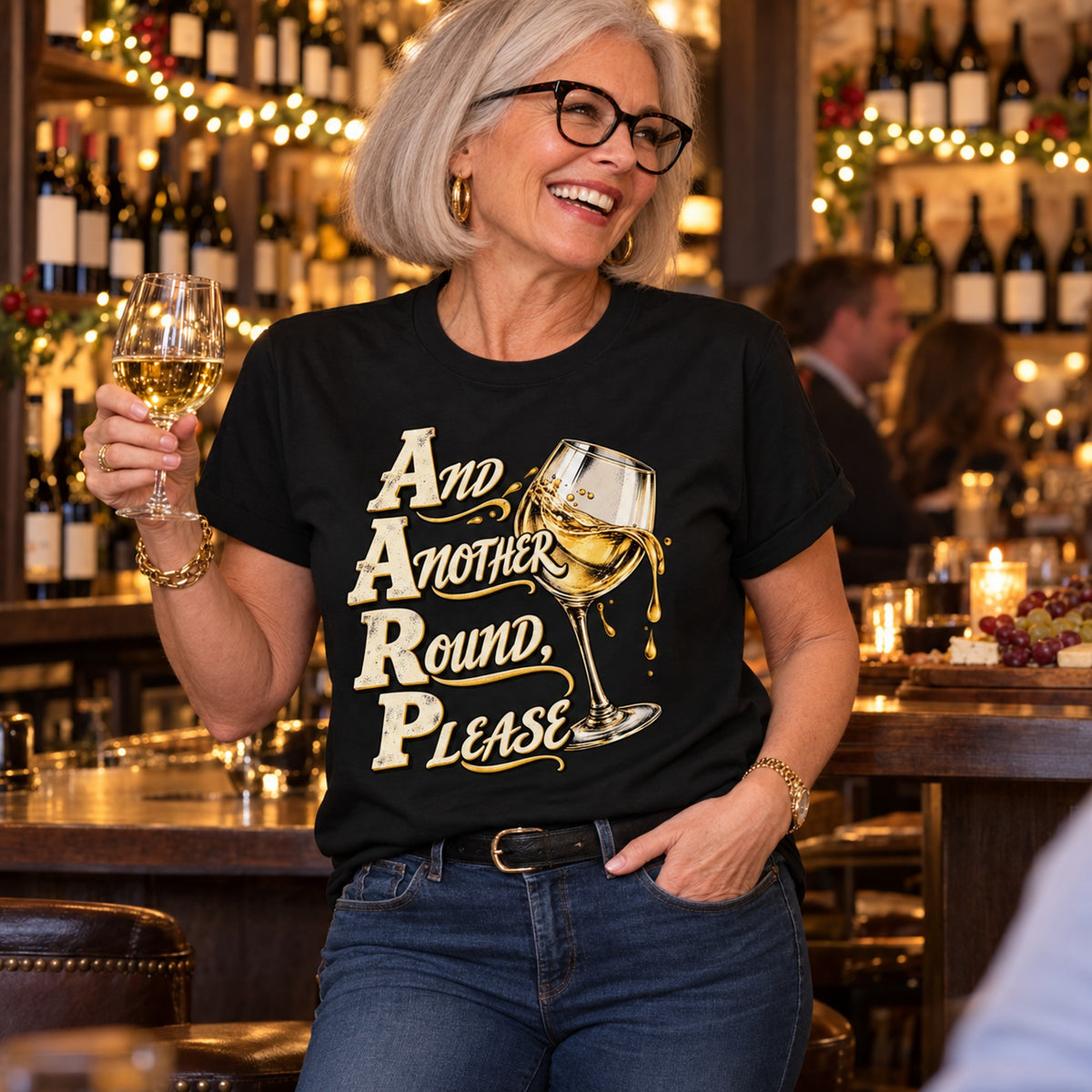 And Another Round, Please T-shirt in Black, worn by Nancy. Nancy is 5′6″ and wears her usual size L. [bb c=black r=hero]
